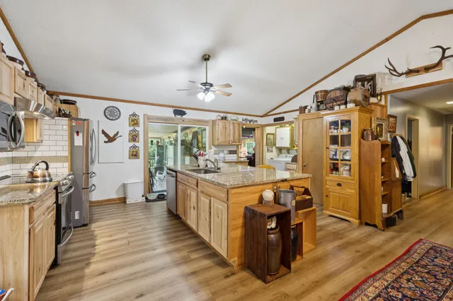 a view of a patio with a table and chairs
