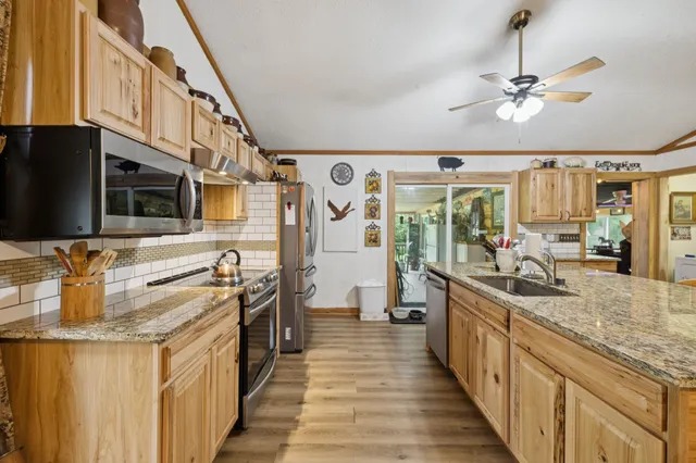 a view of a patio with a table and chairs