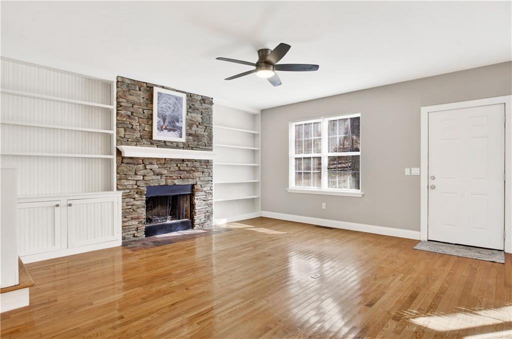 3016 Pathway Road Gainesville, GA 30501 - Photo 14 of 44 a view of an empty room with wooden floor fireplace and a window