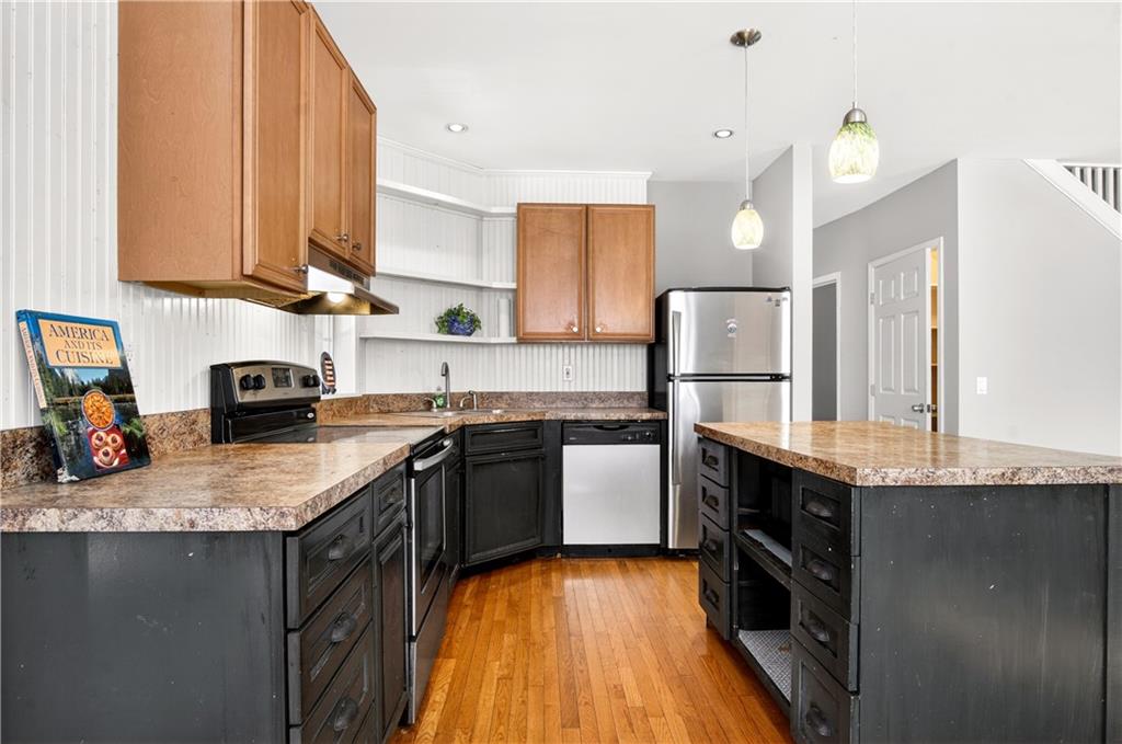 3016 Pathway Road Gainesville, GA 30501 - Photo 15 of 44 a kitchen with granite countertop a sink a counter top space stainless steel appliances and cabinets