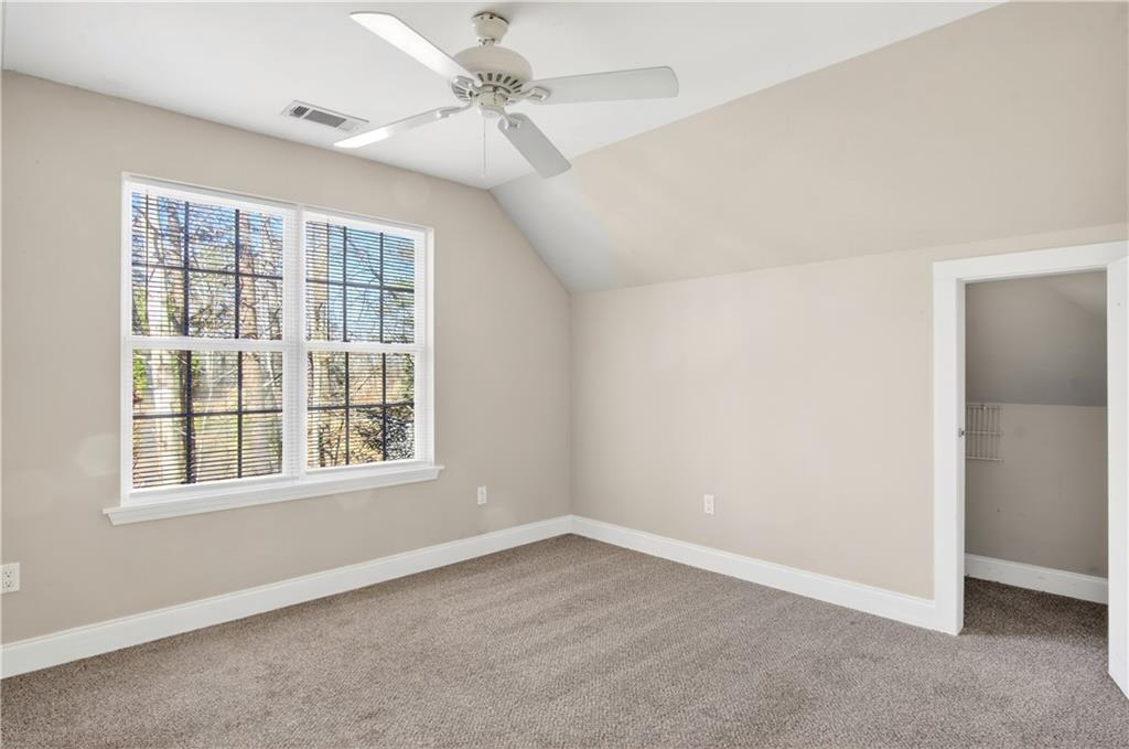 3016 Pathway Road Gainesville, GA 30501 - Photo 26 of 44 an empty room with a window and ceiling fan