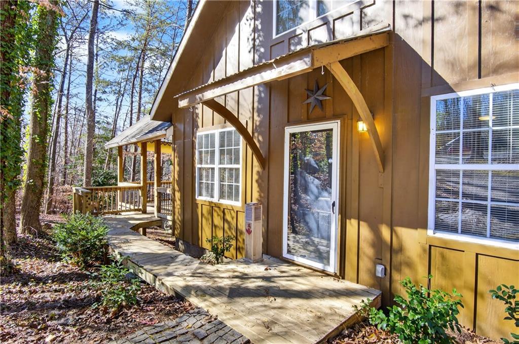 3016 Pathway Road Gainesville, GA 30501 - Photo 9 of 44 a view of a house with large windows and plants