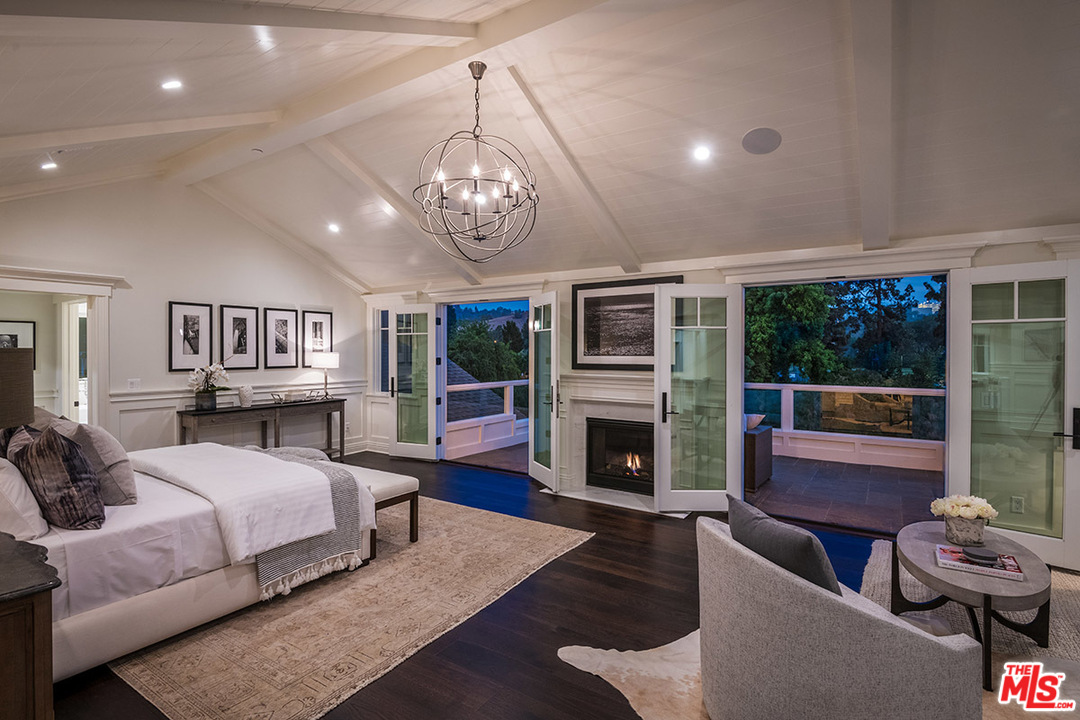 231 South Valley Street Burbank, CA 91505 - Photo 13 of 43 a living room with furniture a fireplace and a chandelier
