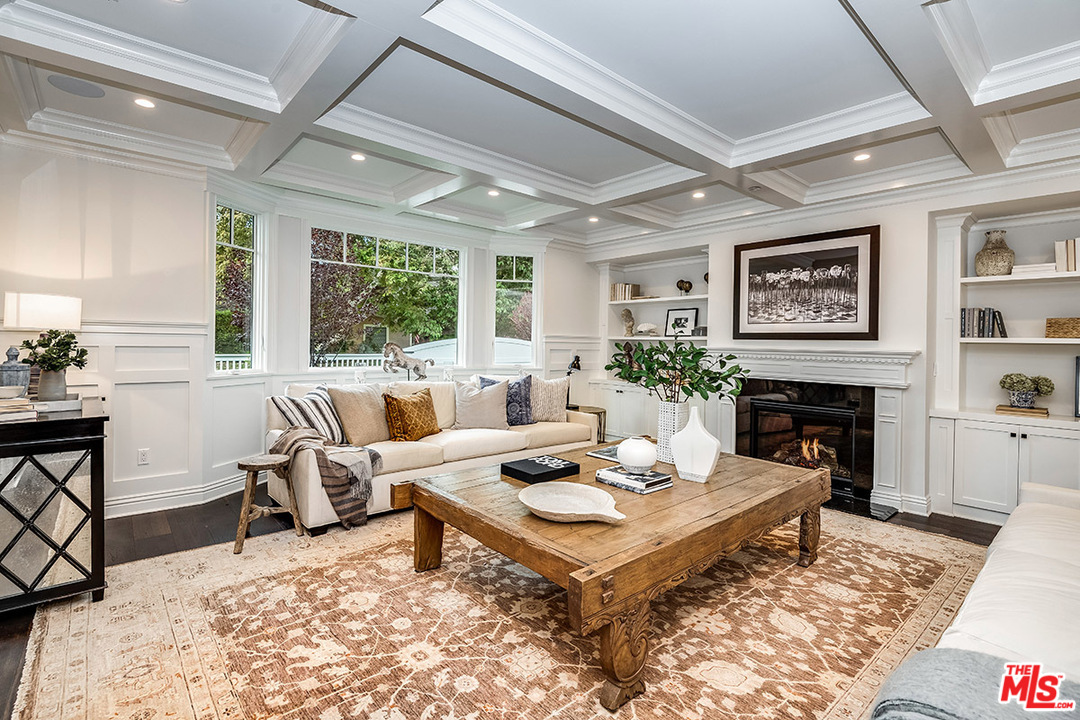 231 South Valley Street Burbank, CA 91505 - Photo 17 of 43 a living room with furniture a fireplace and a table