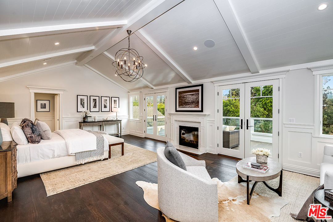 231 South Valley Street Burbank, CA 91505 - Photo 24 of 43 a living room with furniture a fireplace and a table