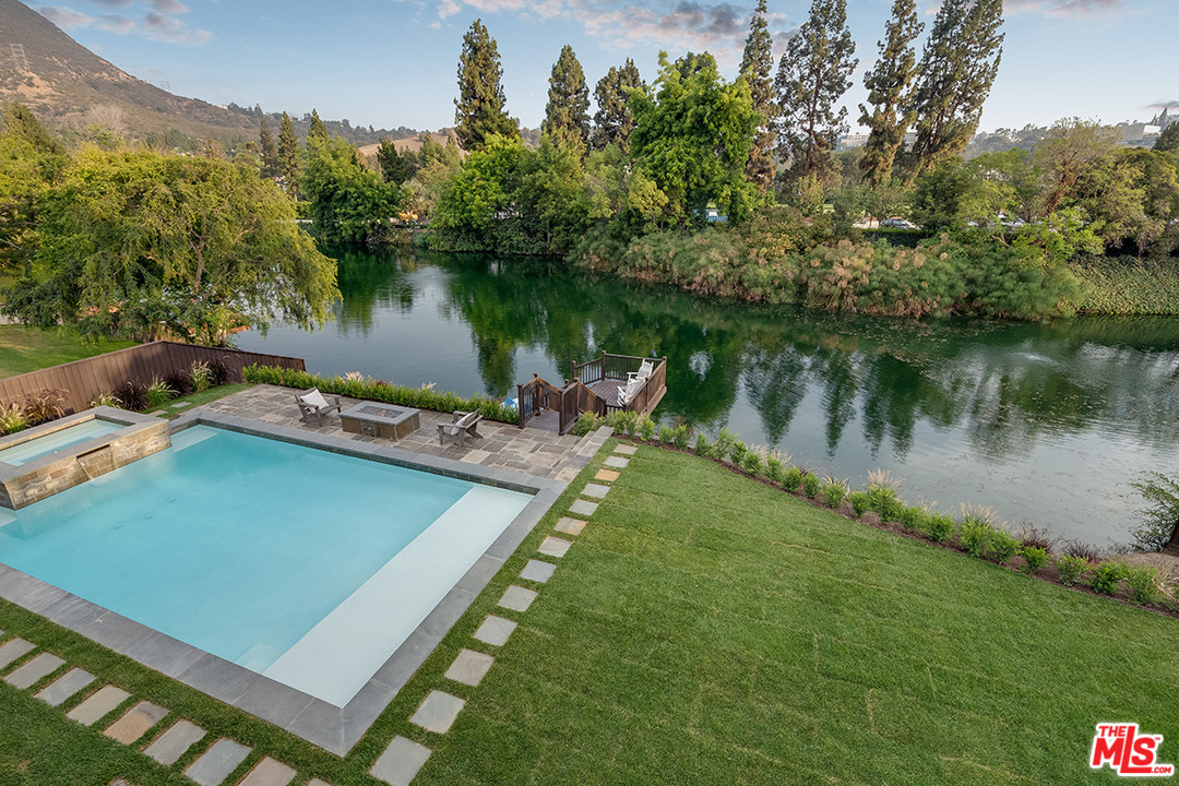 231 South Valley Street Burbank, CA 91505 - Photo 29 of 43 a view of a lake with a yard and a mountain view