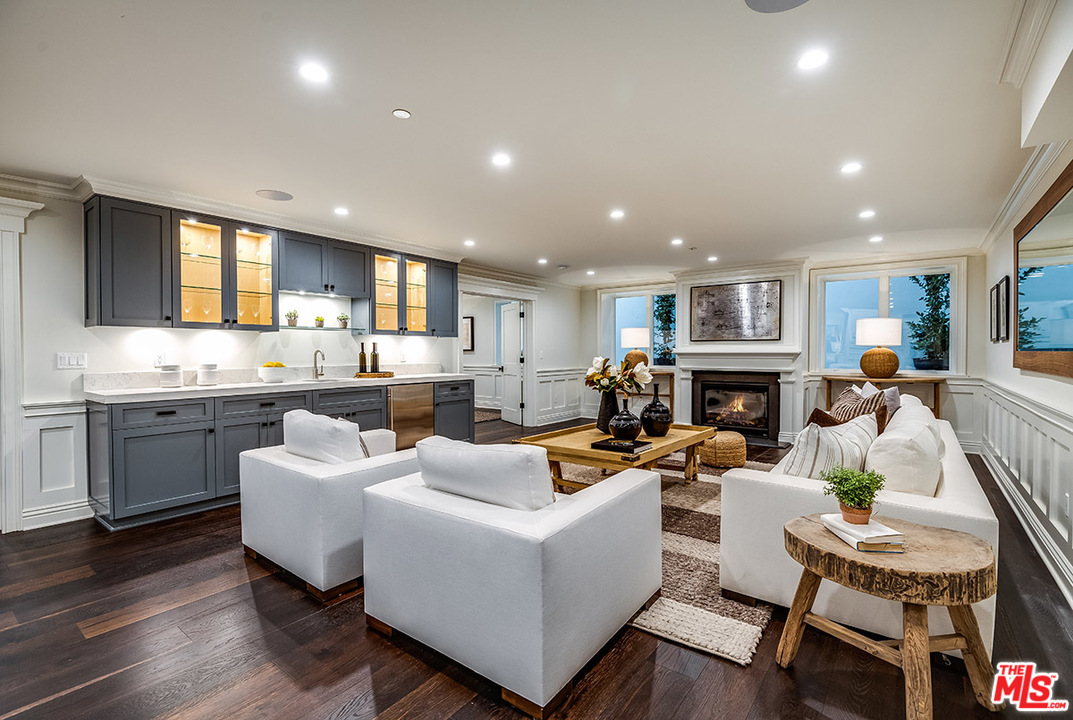 231 South Valley Street Burbank, CA 91505 - Photo 31 of 43 a living room with fireplace furniture and a wooden floor