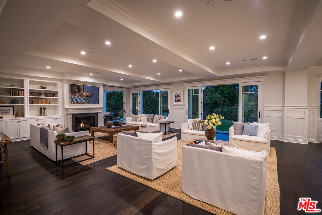 231 South Valley Street Burbank, CA 91505 - Photo 8 of 43 a living room with fireplace furniture and a wooden floor