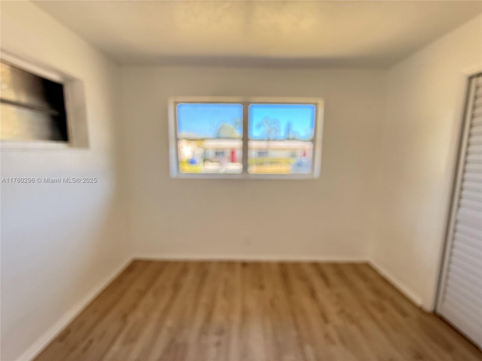 801 Southwest 7th Street, Unit B Pompano Beach, FL 33060 - Photo 12 of 20 a view of a room with a window