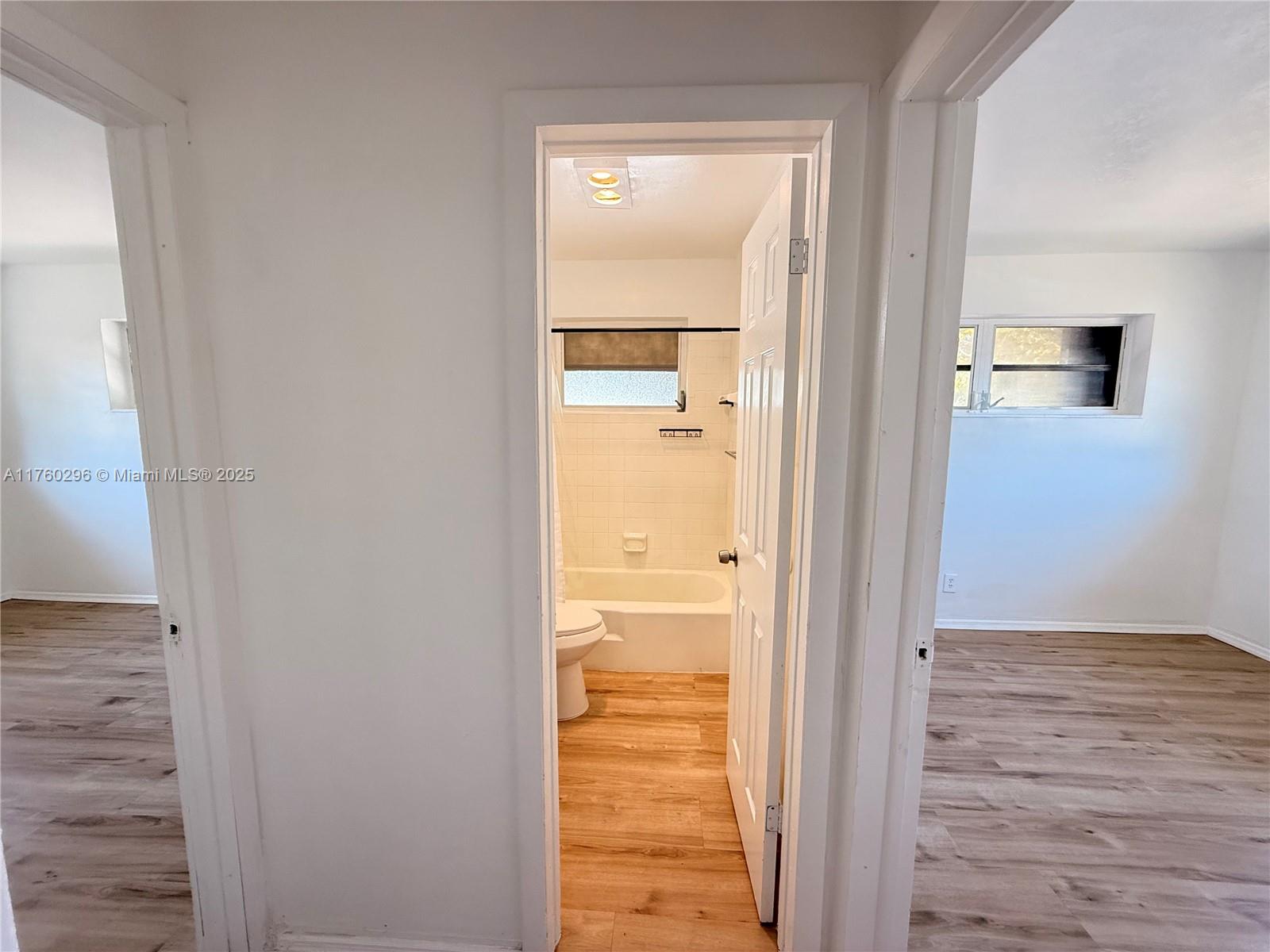 801 Southwest 7th Street, Unit B Pompano Beach, FL 33060 - Photo 10 of 20 a view of a bathroom from a hallway