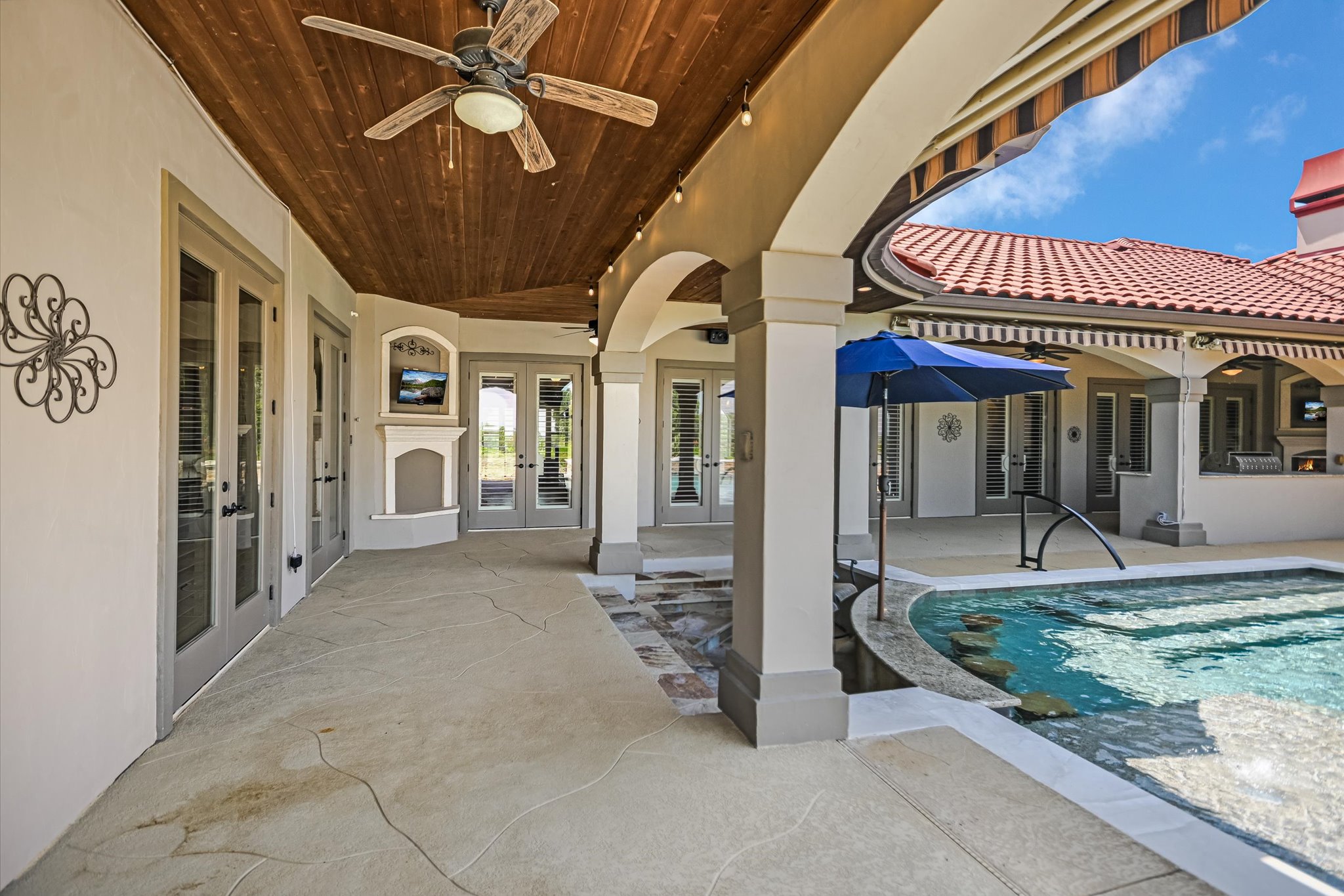 228 Puzzle Pass Spring Branch, TX 78070 - Photo 26 of 35 An inviting 1300 SF covered patio adjoins a resort-style pool, perfect for outdoor leisure.