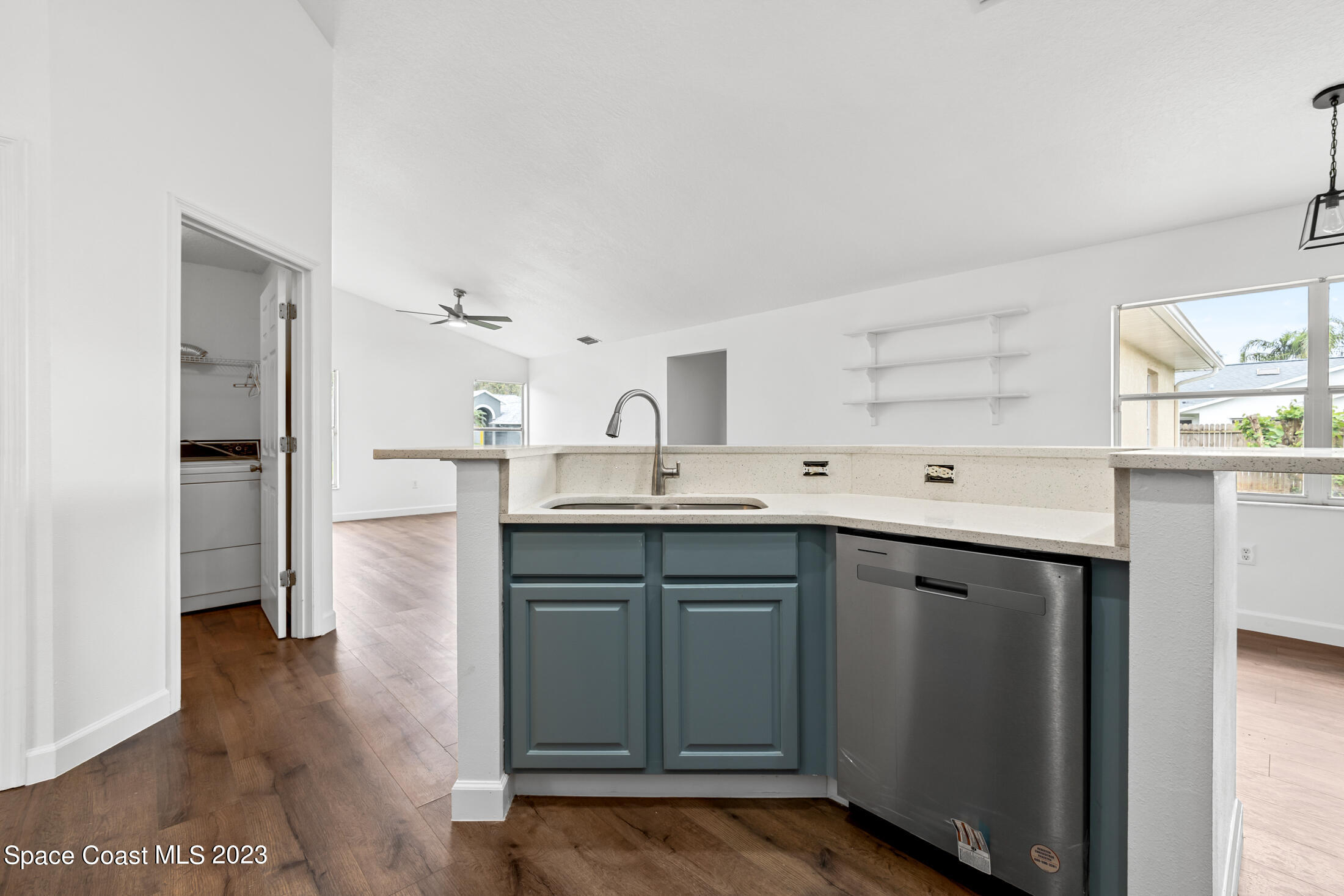1940 Slone Boulevard Melbourne, FL 32935 - Photo 11 of 27 a kitchen with a sink cabinets and stainless steel appliances
