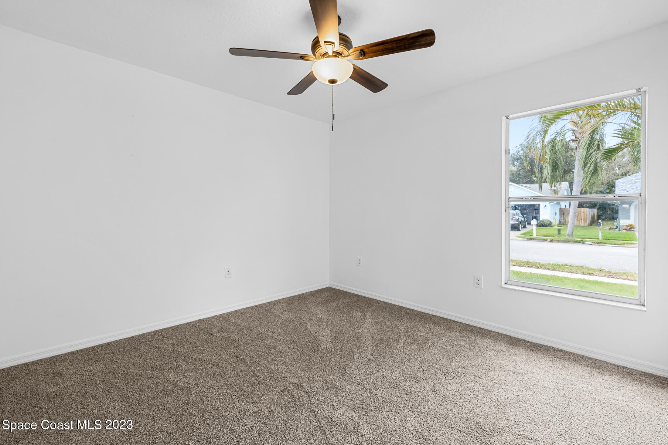1940 Slone Boulevard Melbourne, FL 32935 - Photo 15 of 27 a view of an empty room with a window