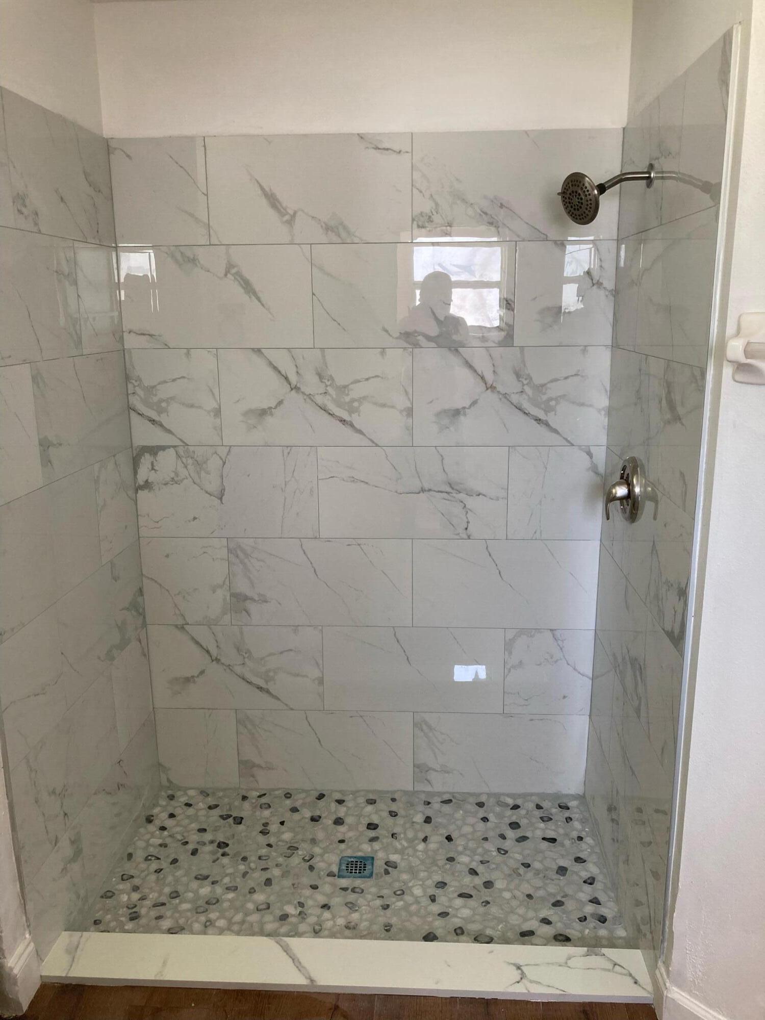 1940 Slone Boulevard Melbourne, FL 32935 - Photo 17 of 27 a bathroom with a shower