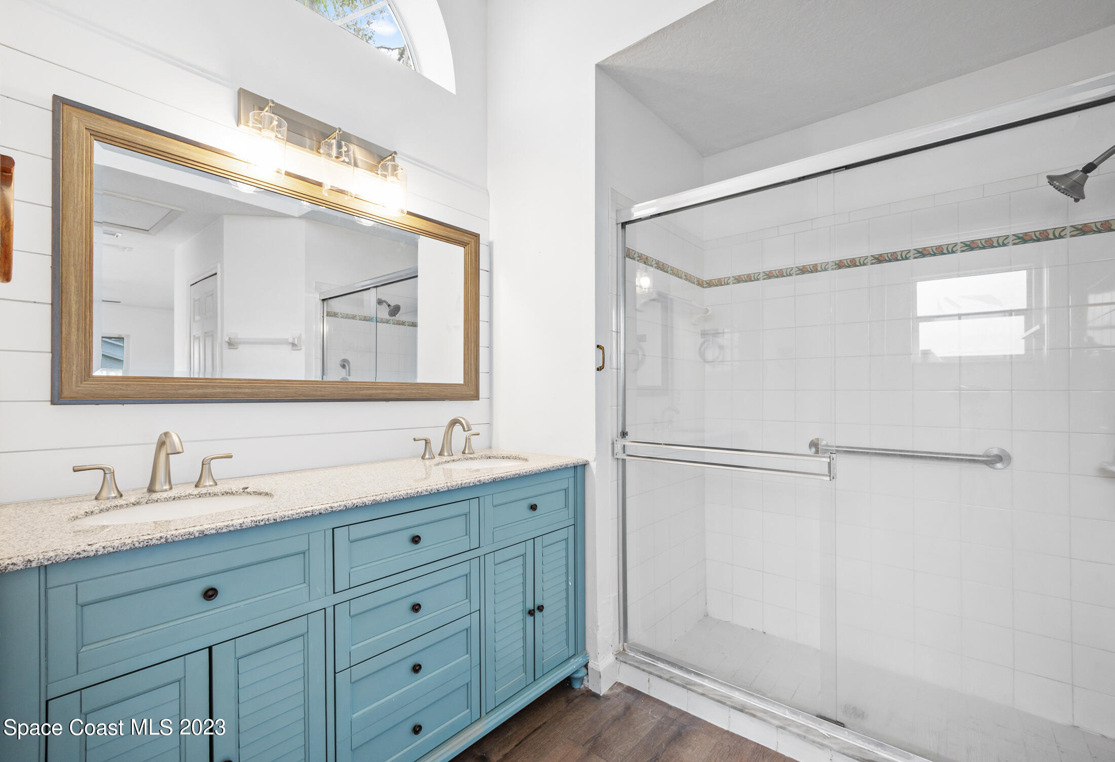 1940 Slone Boulevard Melbourne, FL 32935 - Photo 18 of 27 a bathroom with a double vanity sink mirror and double