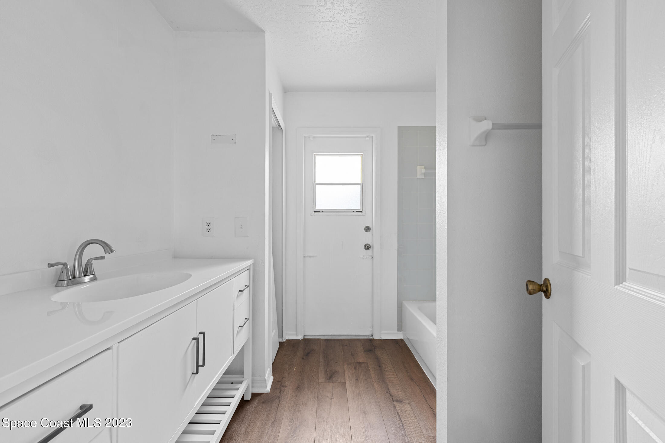 1940 Slone Boulevard Melbourne, FL 32935 - Photo 24 of 27 a bathroom with a sink and mirror