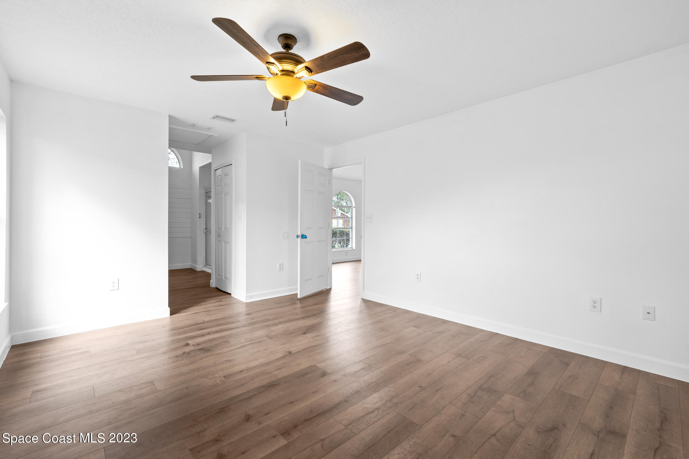1940 Slone Boulevard Melbourne, FL 32935 - Photo 25 of 27 a view of a livingroom with wooden floor