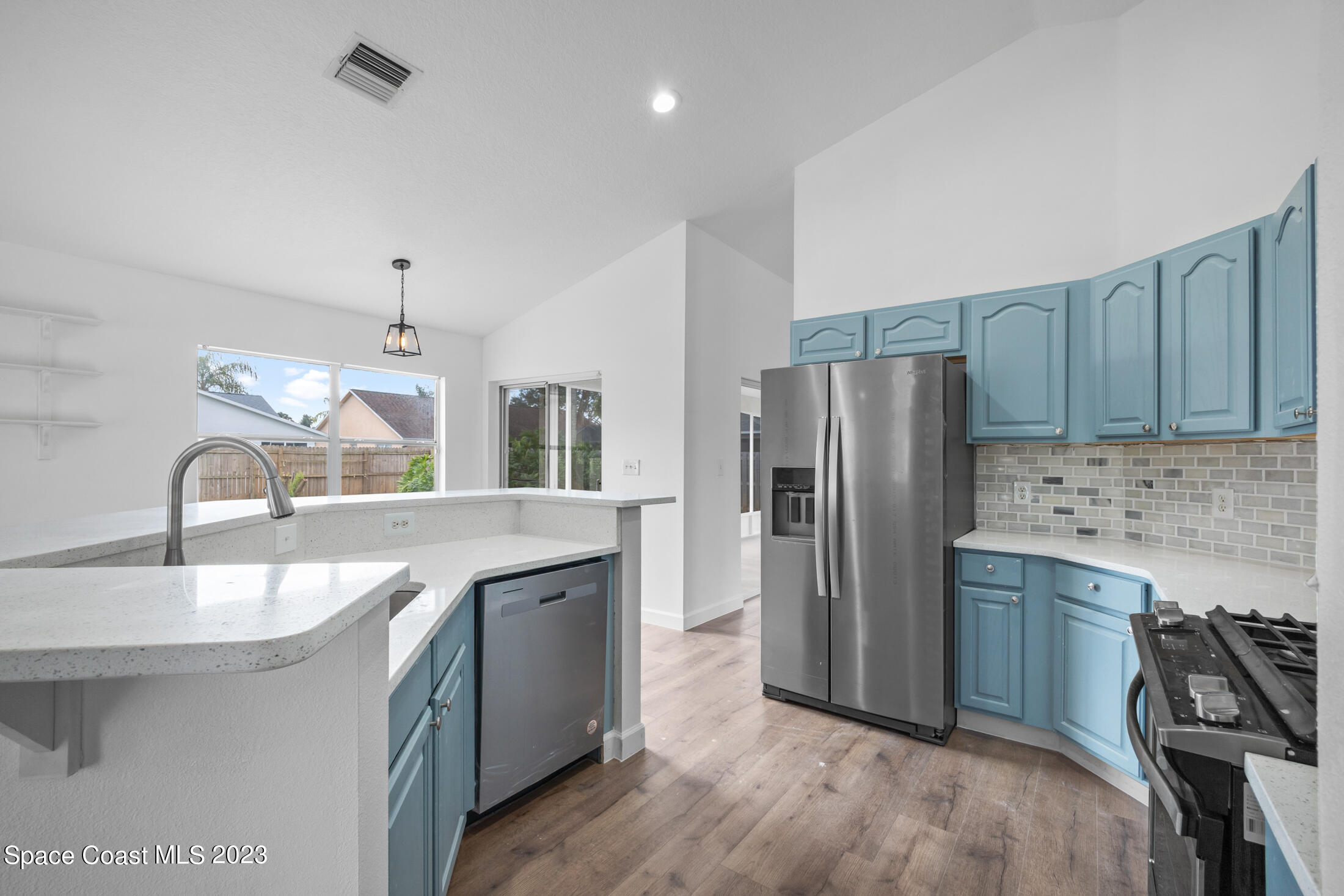 1940 Slone Boulevard Melbourne, FL 32935 - Photo 5 of 27 a kitchen with stainless steel appliances granite countertop a sink stove and refrigerator