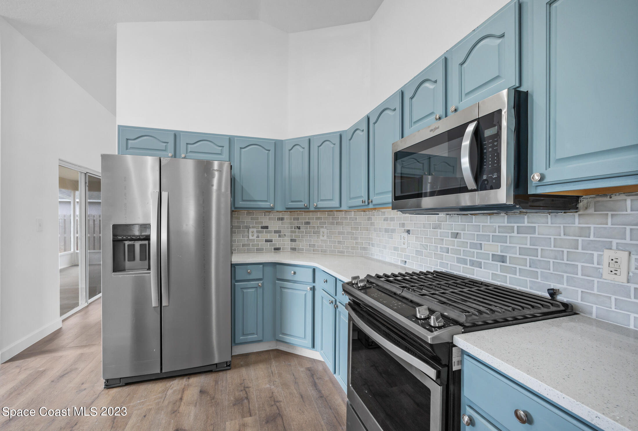 1940 Slone Boulevard Melbourne, FL 32935 - Photo 6 of 27 a kitchen with stainless steel appliances and cabinets