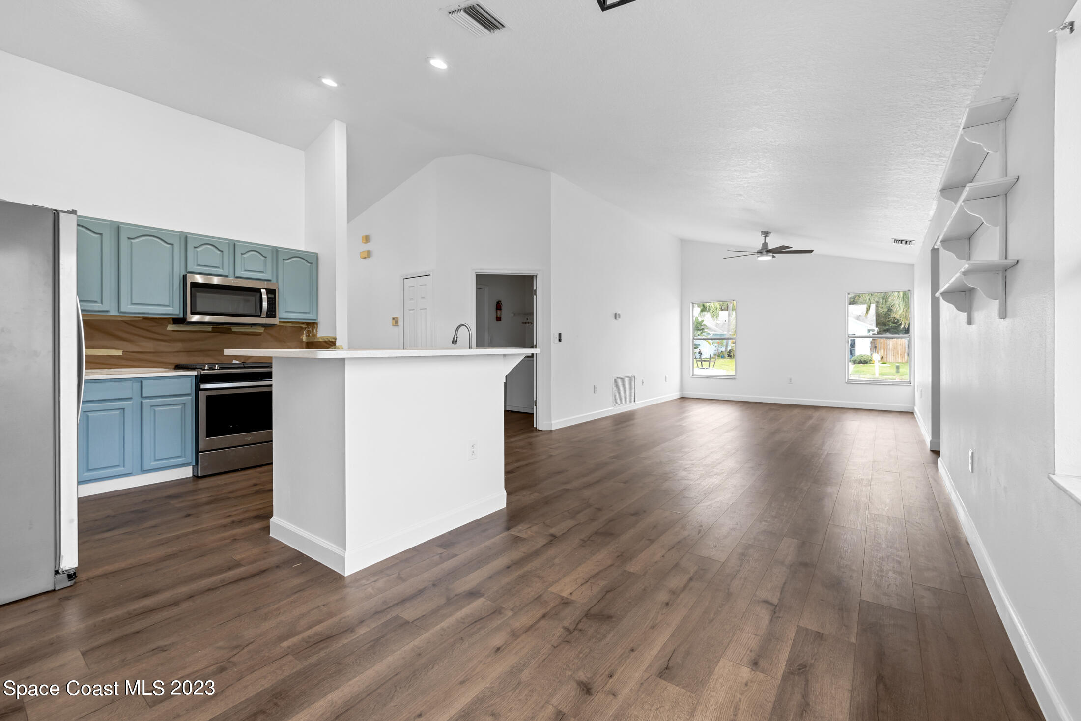 1940 Slone Boulevard Melbourne, FL 32935 - Photo 9 of 27 a view of kitchen with cabinets stainless steel appliances and wooden floor