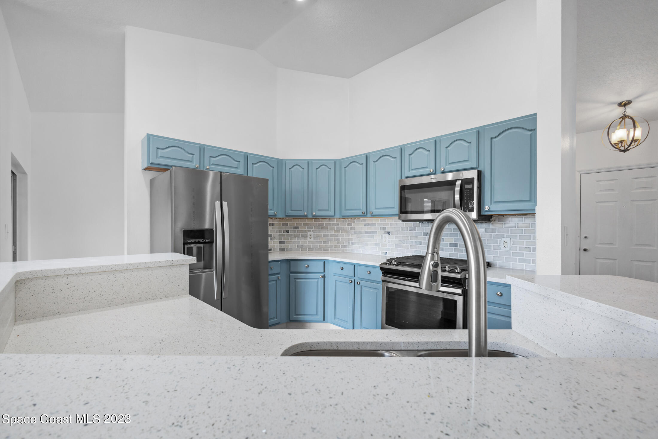 1940 Slone Boulevard Melbourne, FL 32935 - Photo 10 of 27 a kitchen with stainless steel appliances granite countertop a refrigerator and a stove