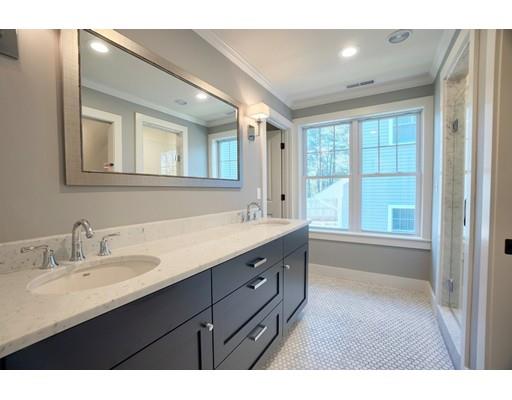 44 Hillcrest Road Waltham, MA 02451 - Photo 13 of 26 a bathroom with a sink double vanity granite tub shower and a mirror