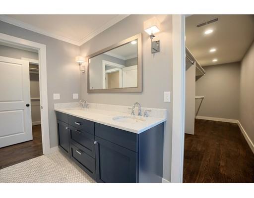 44 Hillcrest Road Waltham, MA 02451 - Photo 15 of 26 a bathroom with a sink a mirror and a shower