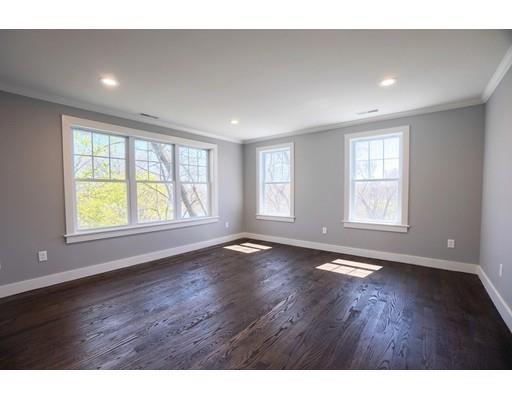 44 Hillcrest Road Waltham, MA 02451 - Photo 16 of 26 a view of an empty room with wooden floor and a window