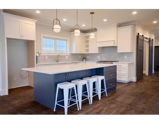 44 Hillcrest Road Waltham, MA 02451 - Photo 3 of 26 a kitchen with cabinets a sink and chairs