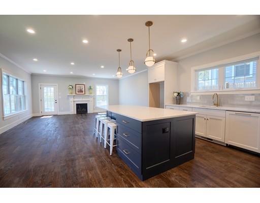 44 Hillcrest Road Waltham, MA 02451 - Photo 4 of 26 a kitchen with stainless steel appliances sink cabinets and wooden floor