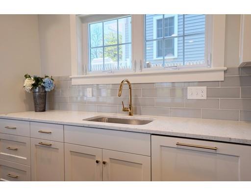 44 Hillcrest Road Waltham, MA 02451 - Photo 5 of 26 a kitchen with a sink and cabinets
