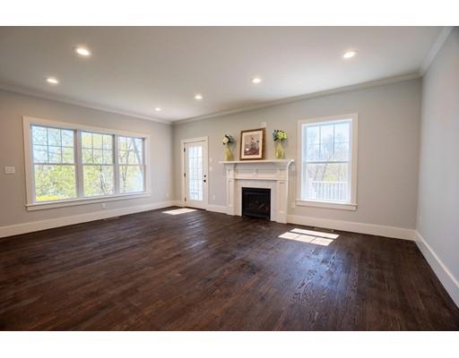 44 Hillcrest Road Waltham, MA 02451 - Photo 7 of 26 a view of empty room with a fireplace and wooden floor