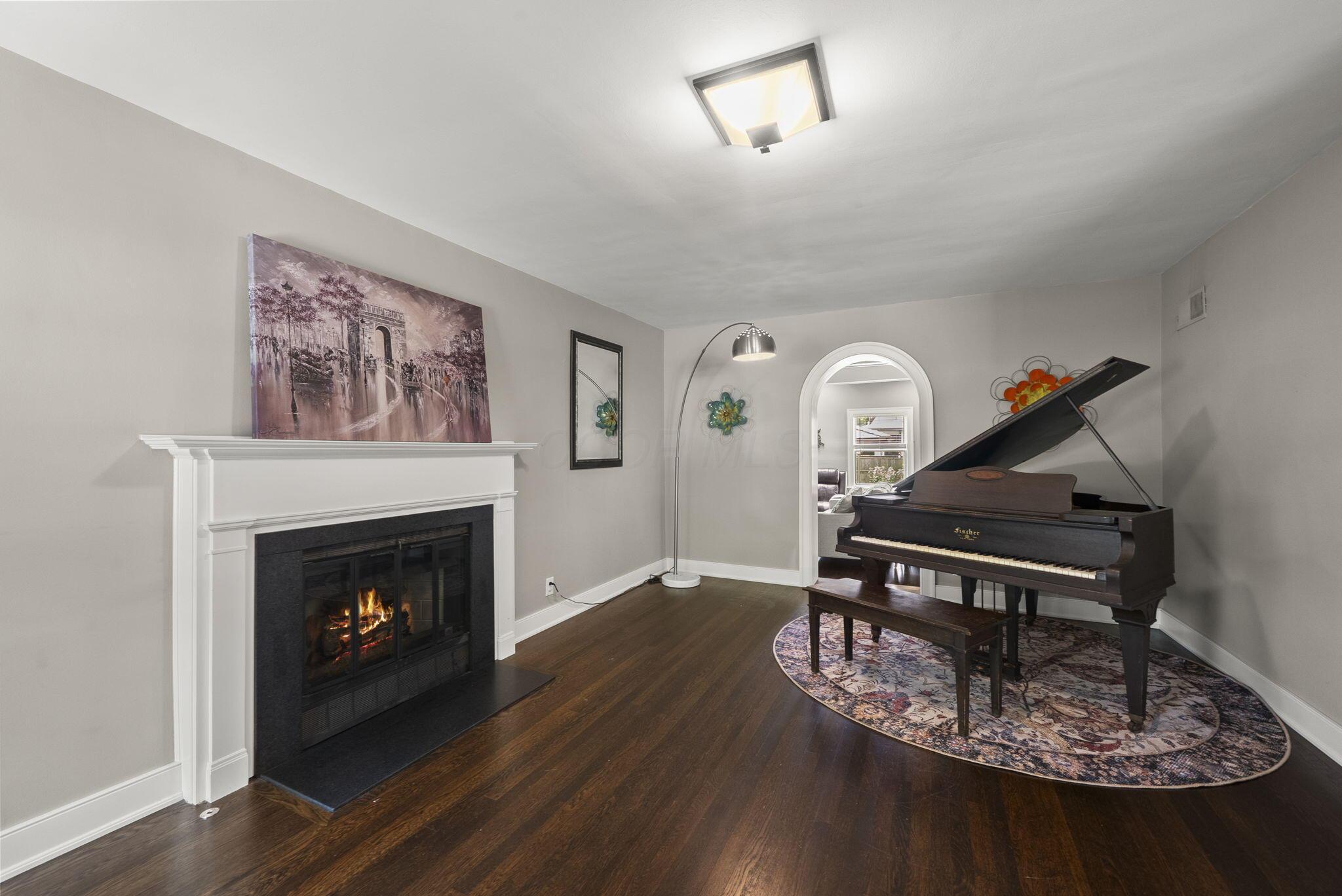 1851 Berkshire Road Columbus, OH 43221 - Photo 3 of 125 Beautiful piano room and formal sitting room with wonderful gas fireplace, beautiful hardwood floors throughout