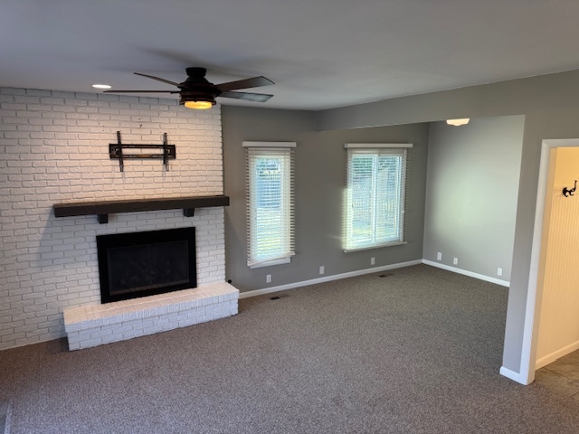 774 Considine Road Geneva, IL 60134 - Photo 23 of 43 an empty room with windows and fireplace