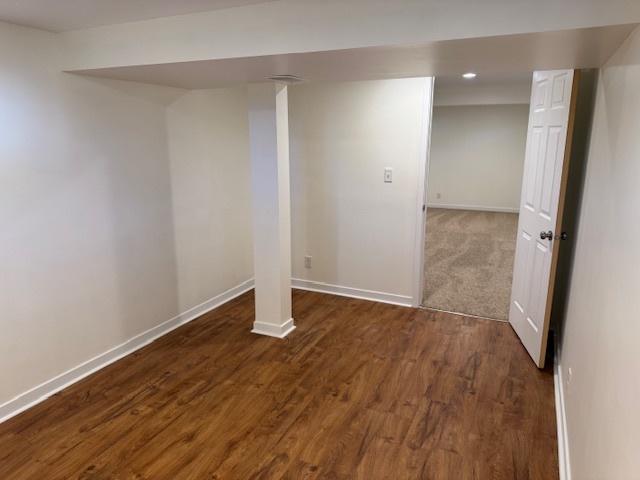 774 Considine Road Geneva, IL 60134 - Photo 33 of 43 a view of an empty room with wooden floor and a window