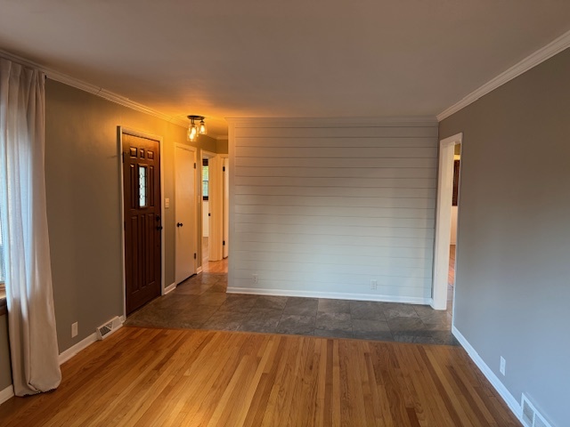 774 Considine Road Geneva, IL 60134 - Photo 4 of 43 an empty room with wooden floor and entrance
