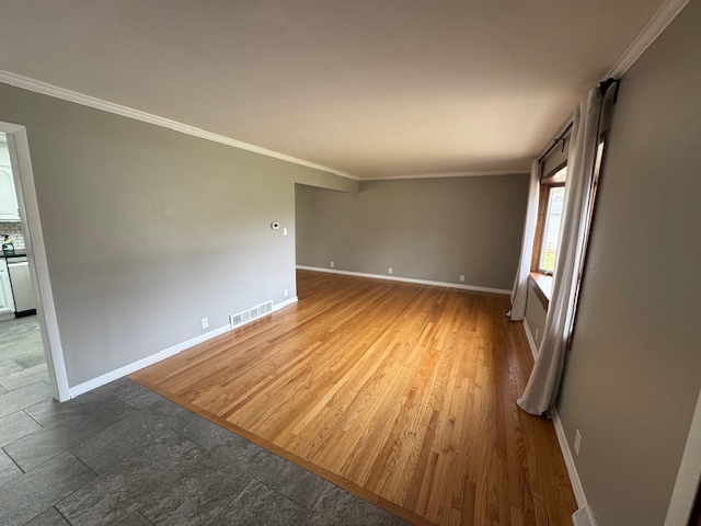 774 Considine Road Geneva, IL 60134 - Photo 5 of 43 wooden floor in an empty room with a window