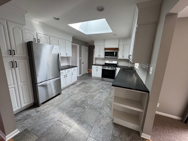 774 Considine Road Geneva, IL 60134 - Photo 10 of 43 a kitchen with granite countertop a refrigerator and a stove top oven