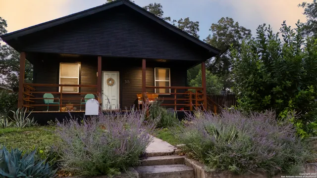 a backyard of a house with seating space