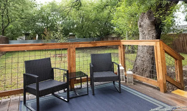 a patio with table and chairs