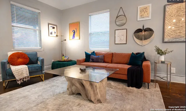 a living room with furniture and a window