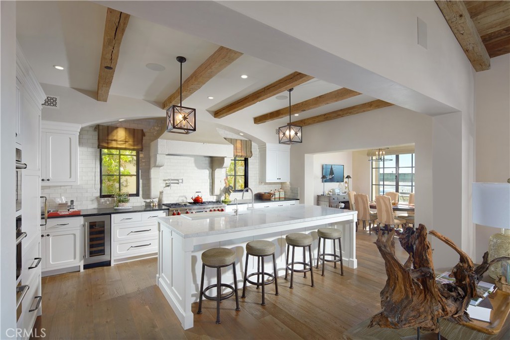 17 Pacific Ridge Place Dana Point, CA 92629 - Photo 11 of 46 a large kitchen with a table and chairs