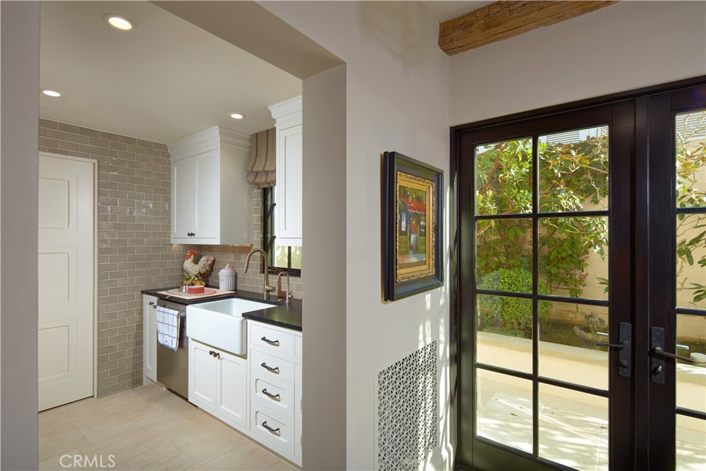 17 Pacific Ridge Place Dana Point, CA 92629 - Photo 14 of 46 a bathroom with a double vanity sink a mirror and a window