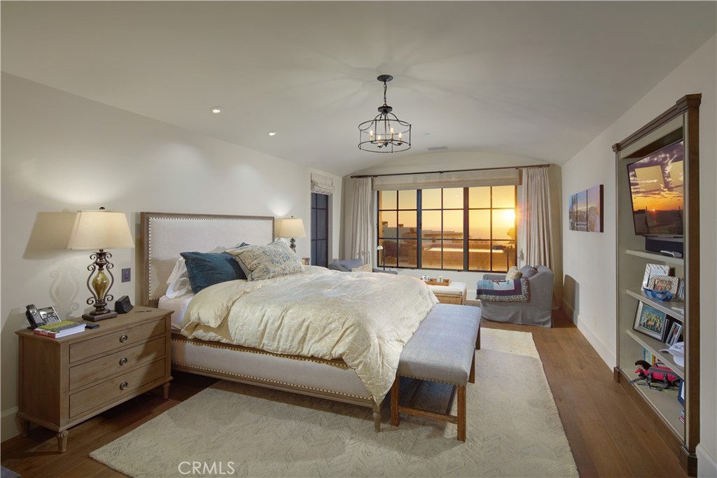 17 Pacific Ridge Place Dana Point, CA 92629 - Photo 16 of 46 a spacious bedroom with a bed and a flat screen tv