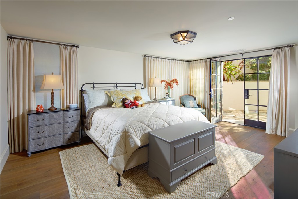 17 Pacific Ridge Place Dana Point, CA 92629 - Photo 28 of 46 a spacious bedroom with a bed and wooden floor