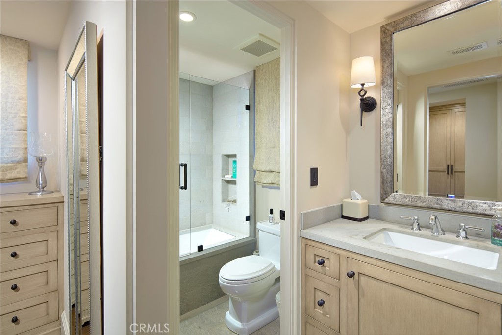 17 Pacific Ridge Place Dana Point, CA 92629 - Photo 29 of 46 a bathroom with a granite countertop toilet sink and a mirror