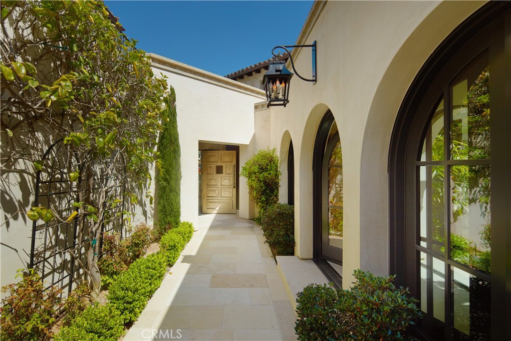 17 Pacific Ridge Place Dana Point, CA 92629 - Photo 4 of 46 a view of a pathway of a house with a porch