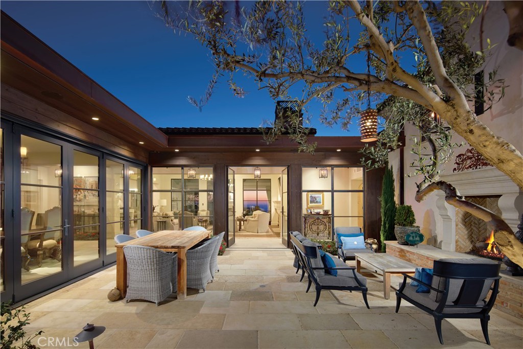 17 Pacific Ridge Place Dana Point, CA 92629 - Photo 7 of 46 a view of a patio with a dining table and chairs
