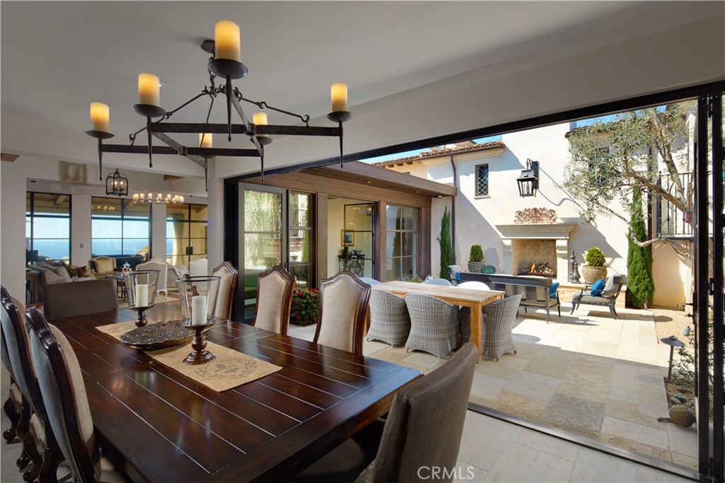 17 Pacific Ridge Place Dana Point, CA 92629 - Photo 9 of 46 a view of a dining room with furniture wooden floor and chandelier