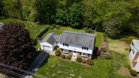 an aerial view of a house with a garden